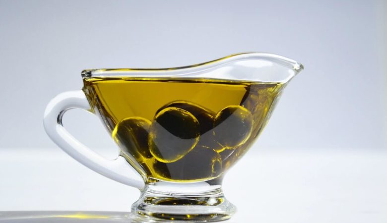 olives in a jar of olive oil