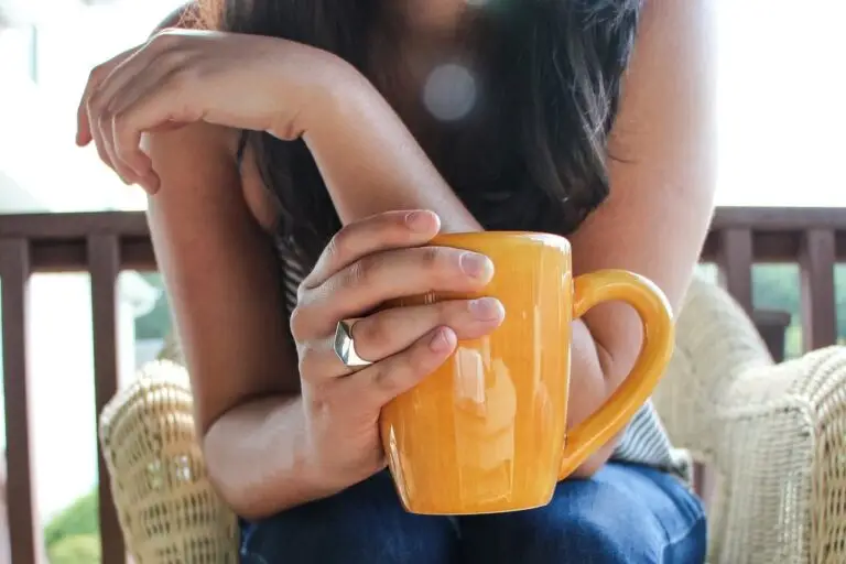 Woman enjoying Bulletproof coffee, a key component of the Bulletproof Diet